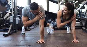 Toning Bingo Wings: Your Ultimate Guide to Sculpting Sleek Arms at the Gym 3 Fitness trainer demonstrating arm toning exercises Brentford